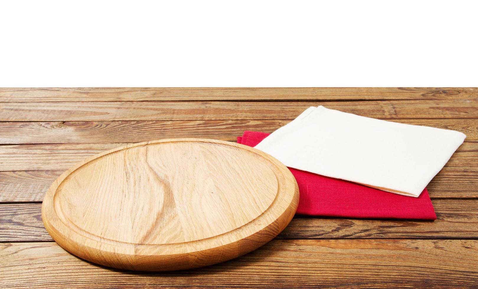 empty food pizza board and napkins on table isolated on white background copy space photo