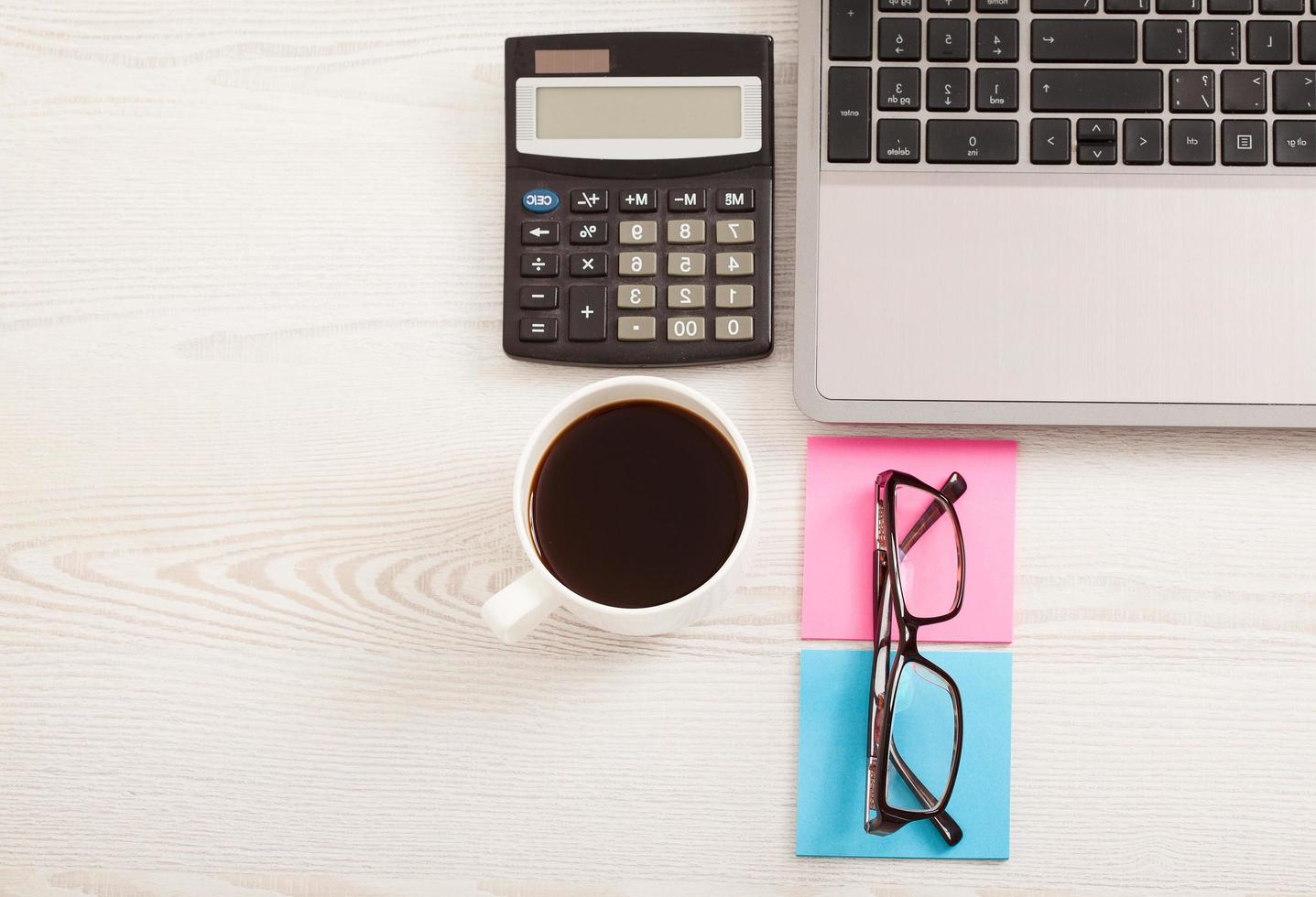 Creative workspace with work accessories and copy space on wooden table. Top view photo