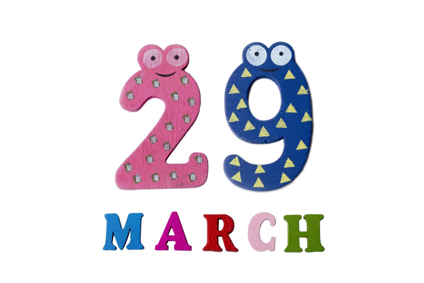 March 29 on white background, numbers and letters. photo