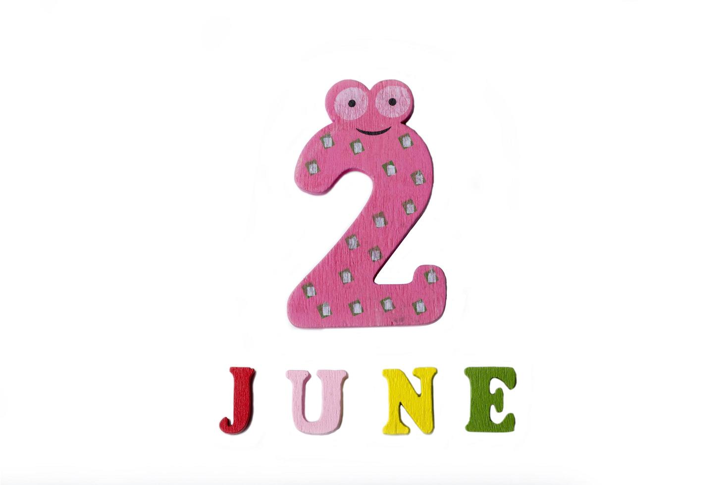 The number two and the word June on a white background. photo