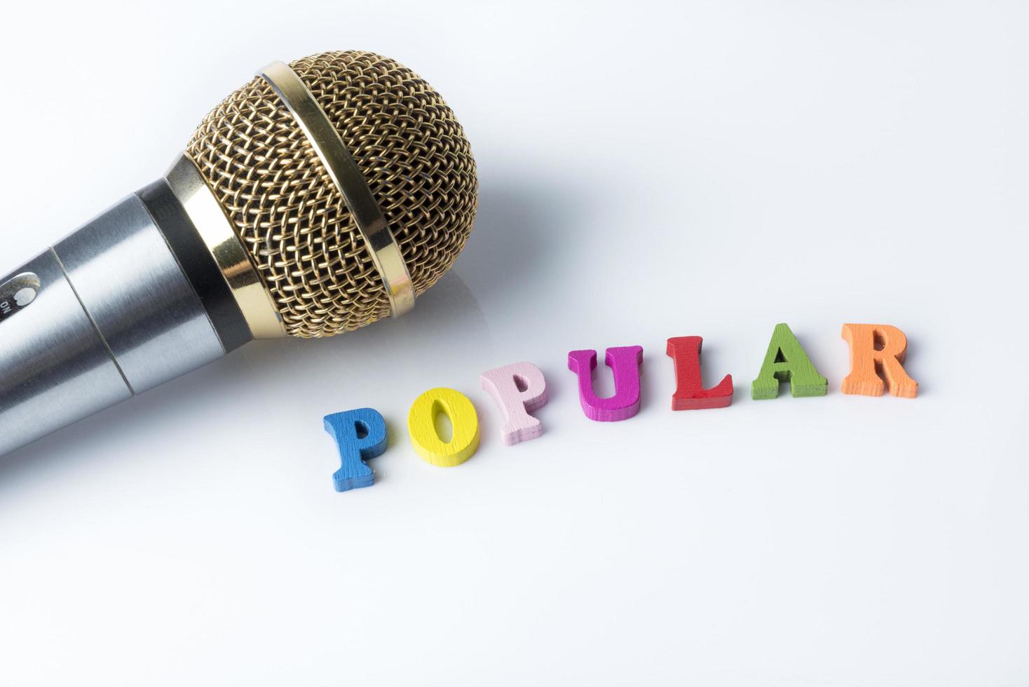 Microphone on a white background, close-up. photo