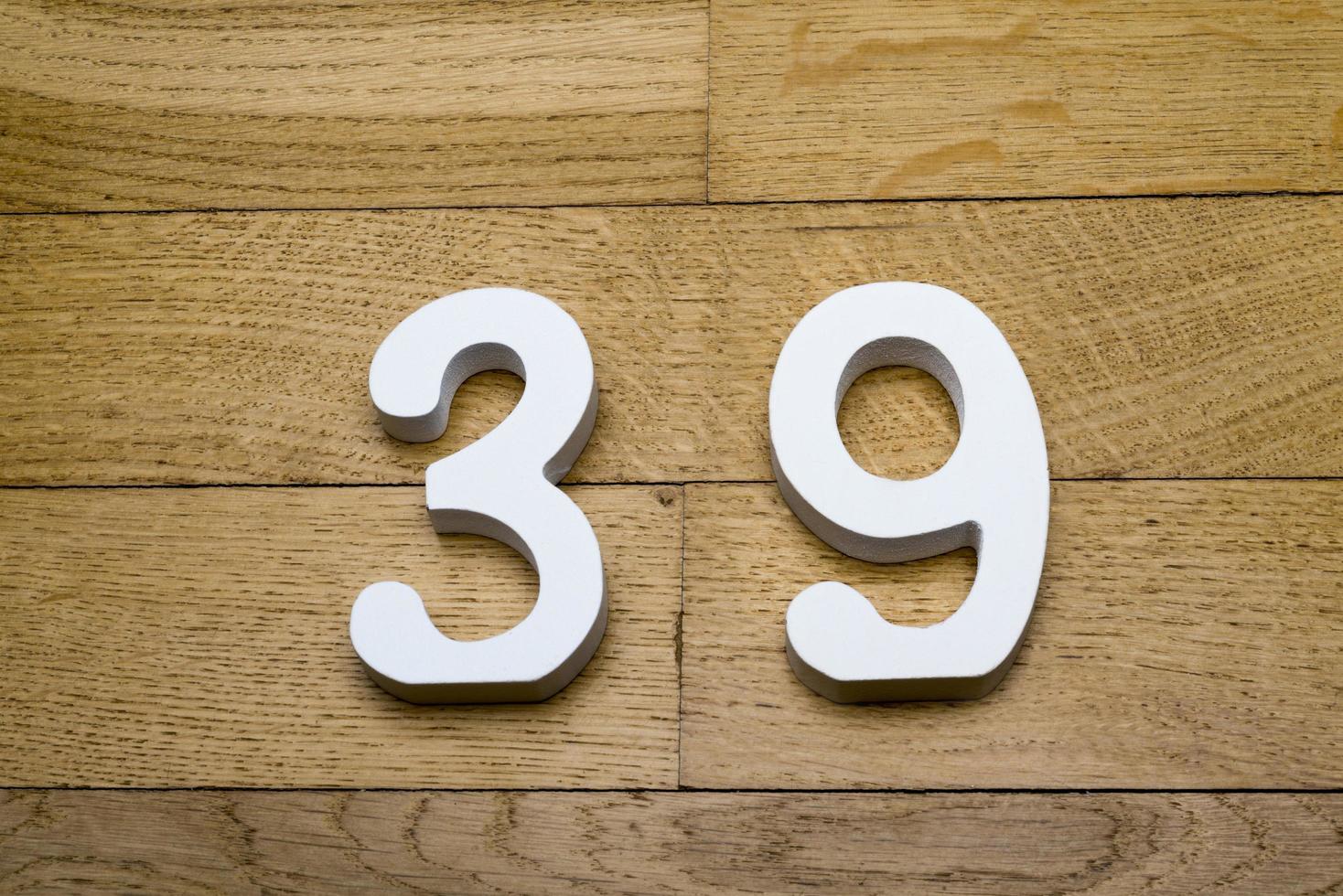 Figure thirty-nine on the wooden, parquet floor. photo
