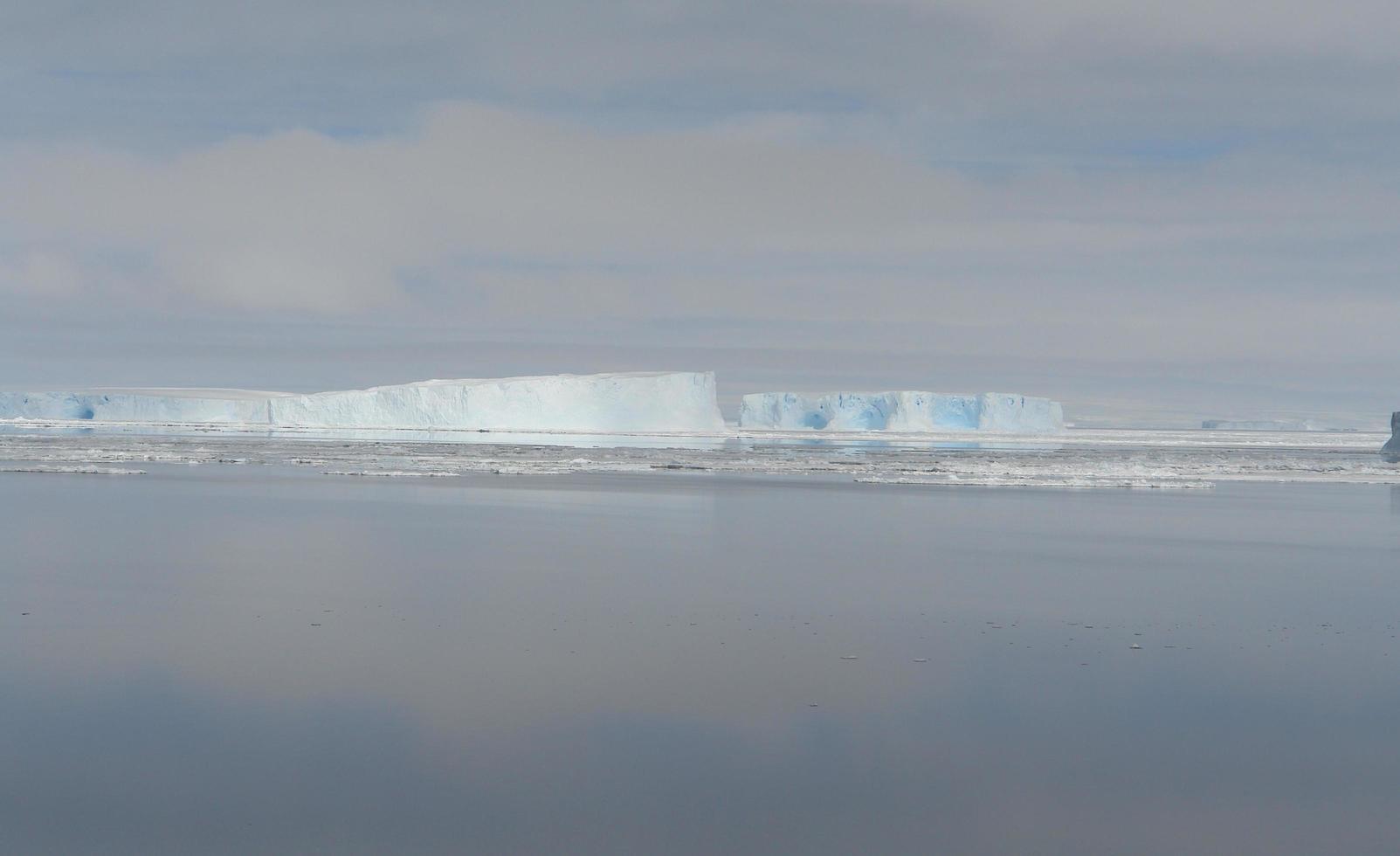 Antarctica endless ice fields icebergs in the sea photo