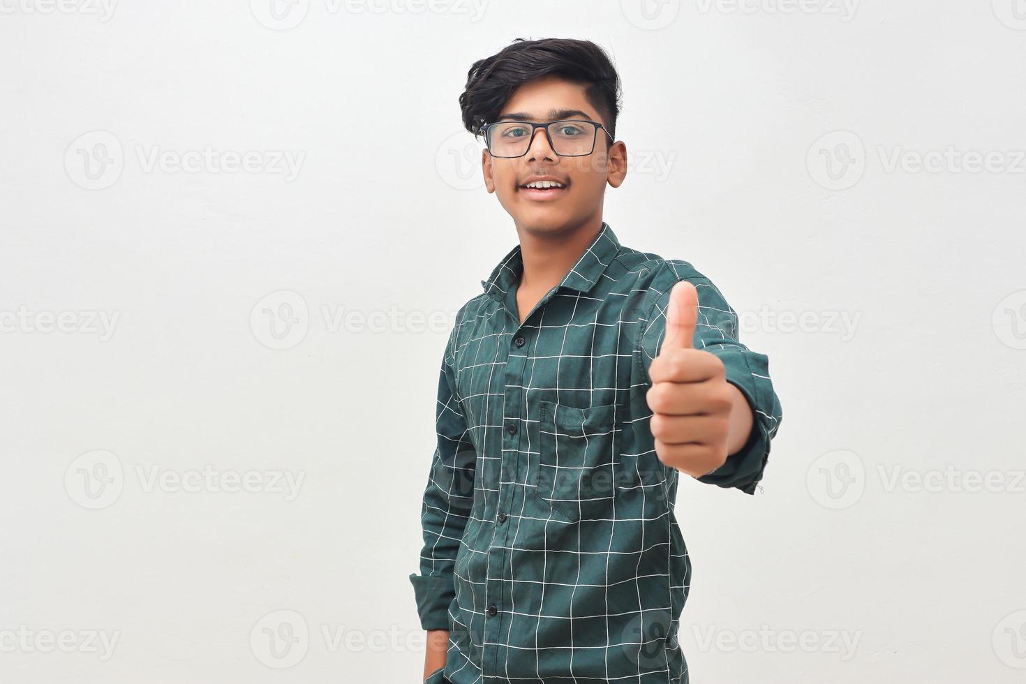 Young indian man showing thump up. photo