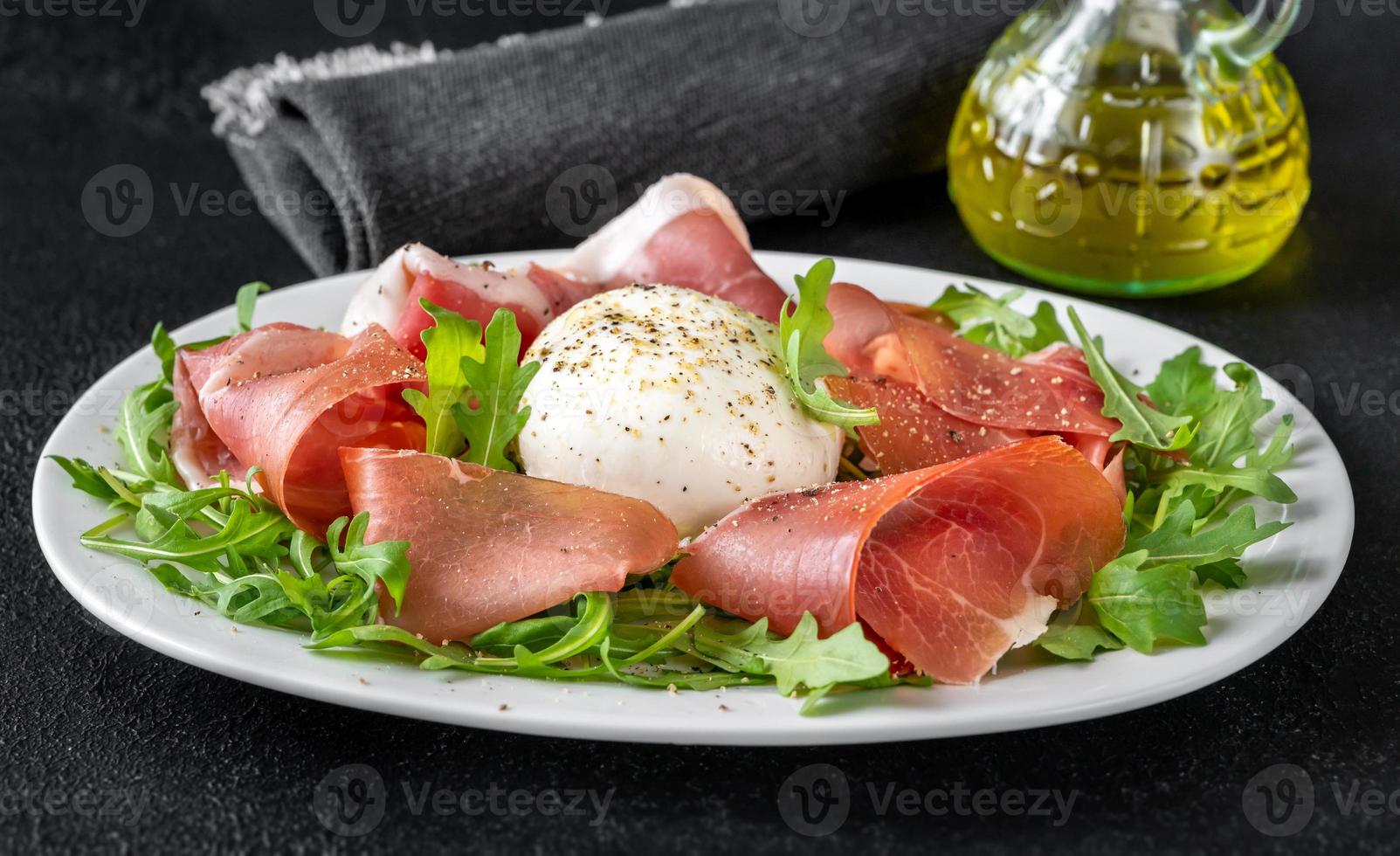 Antipasto with prosciutto and mozzarella photo