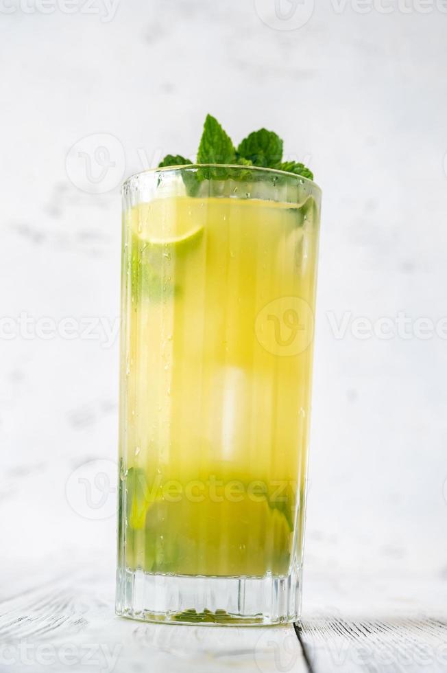 Glass of pineapple mojito photo