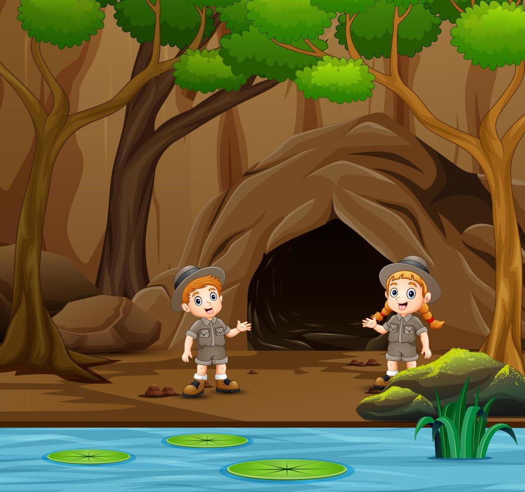 Scout boy and girl talking near the cave vector