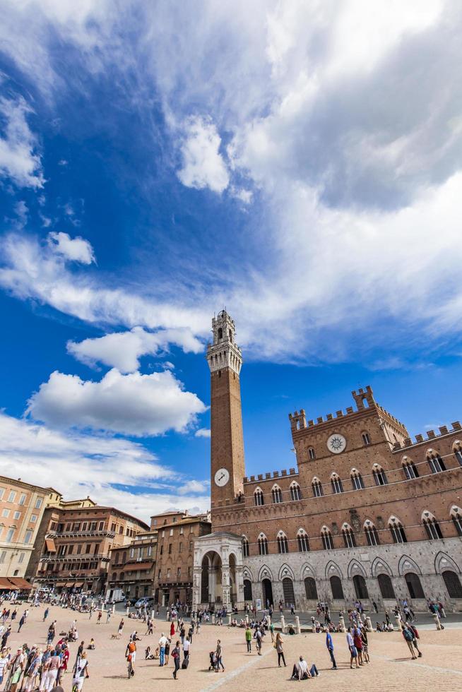 Siena, Italy, September 21, 2016 - Unidentified people at Piazza del Campo in Siena. It was built in 13th century and is regarded as one of Europe greatest medieval squares photo