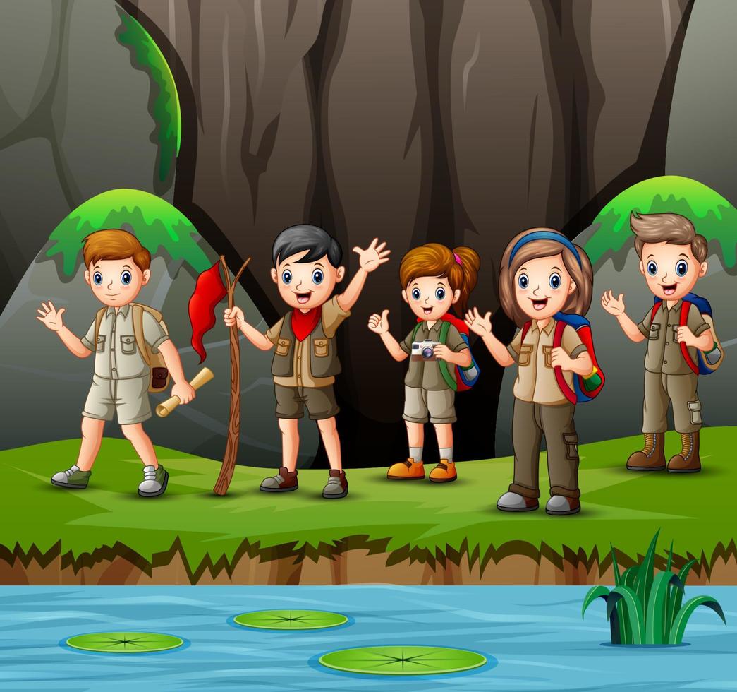 Group of young scout girls and boys in nature vector