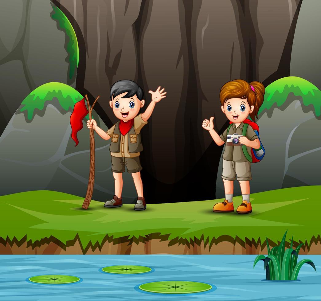 Cartoon of scout boy and girl exploring nature vector