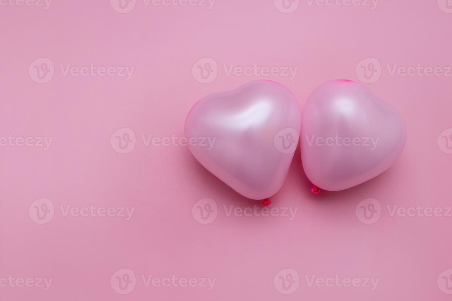 valentines day flat lay with heart shape two balloons copy space monochrome pink photo