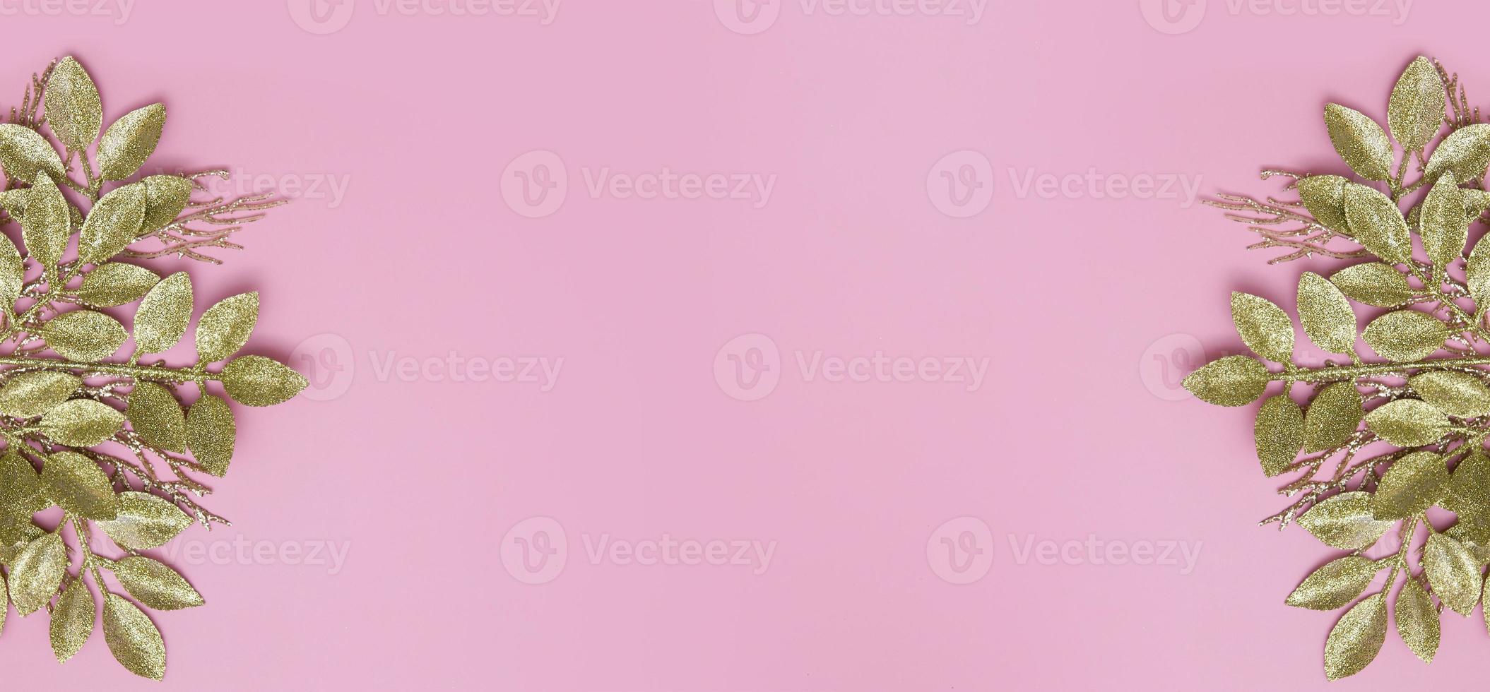 Floral banner with golden branches on pink background copy space photo