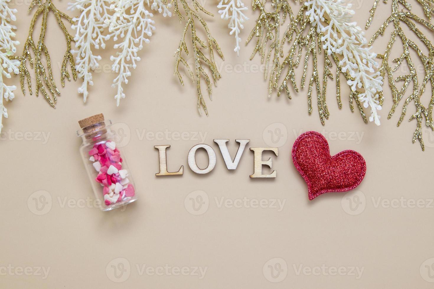 word love wooden letters with red heart and bottle. Creative love concept photo