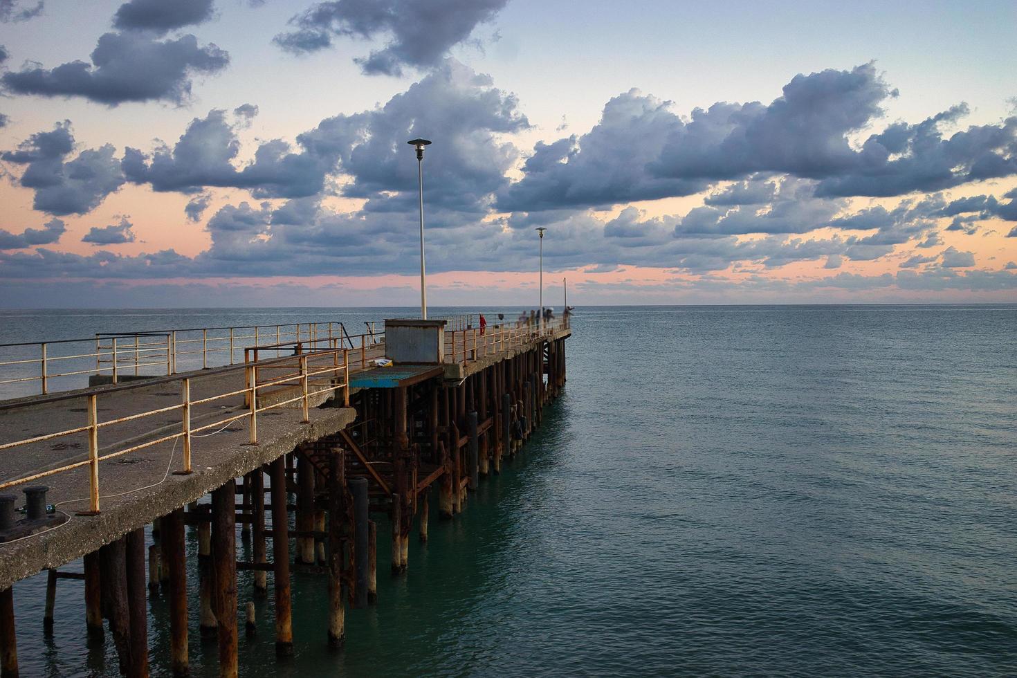 Seascape with sunset view and pier. New Athos, Abkhazia photo