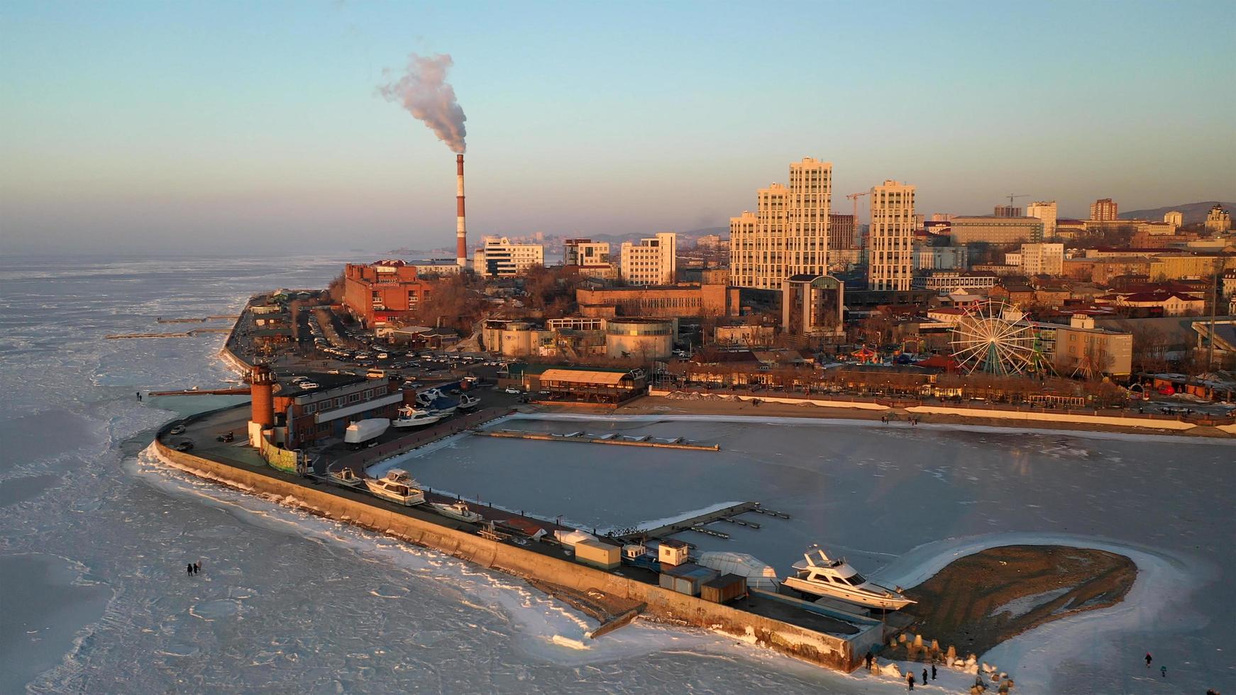 Vladivostok, Russia - January 7, 2022-Aerial view of the urban landscape with a view of the embankment near the Amur Bay. photo