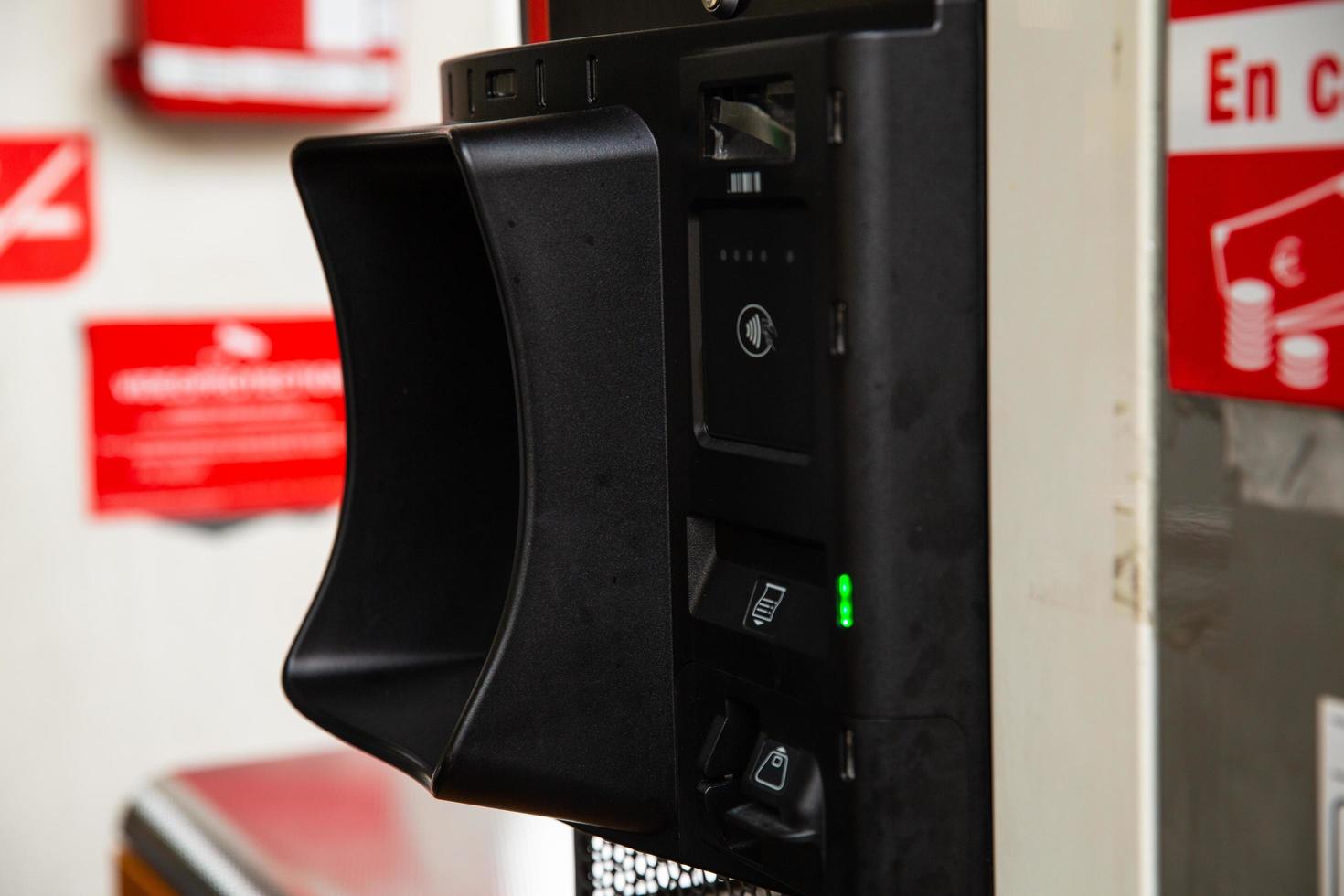 Paris, France, 2021 - Paying at the fuel pump at local gas station. photo