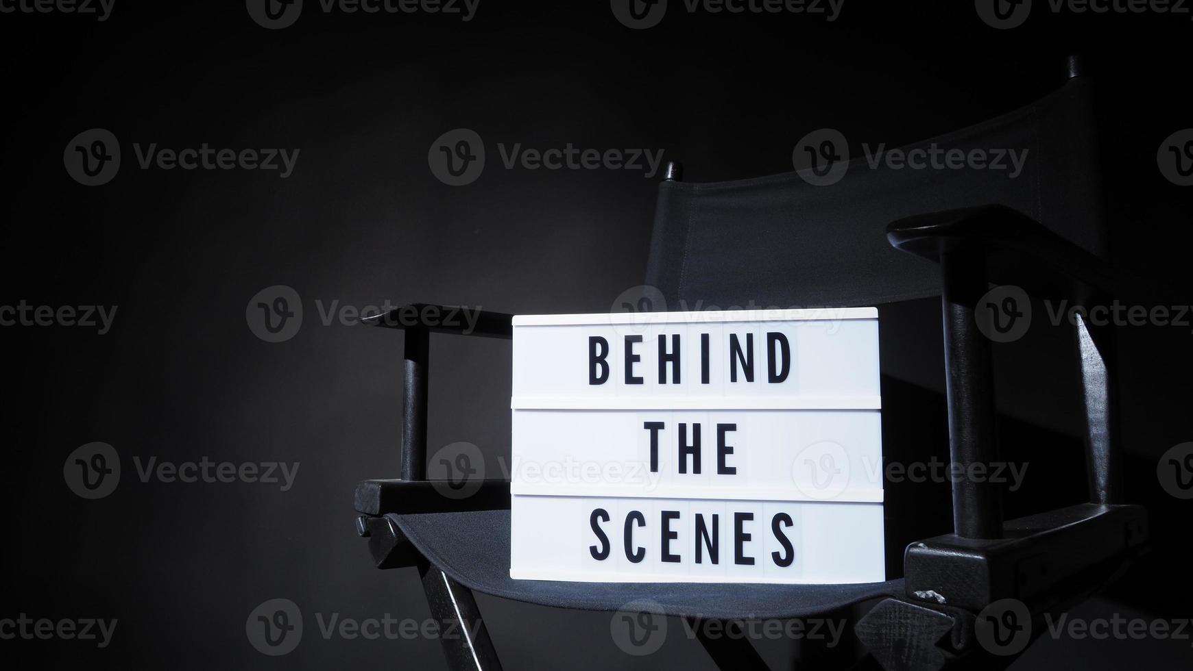 Director chair with behind the scene banner light box. photo