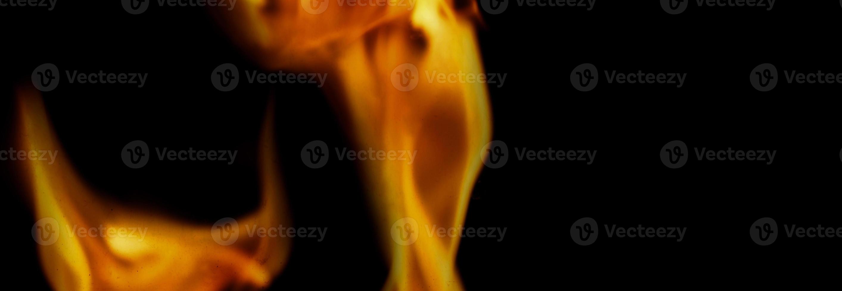 Fire background. Abstract burning flame and black background. photo