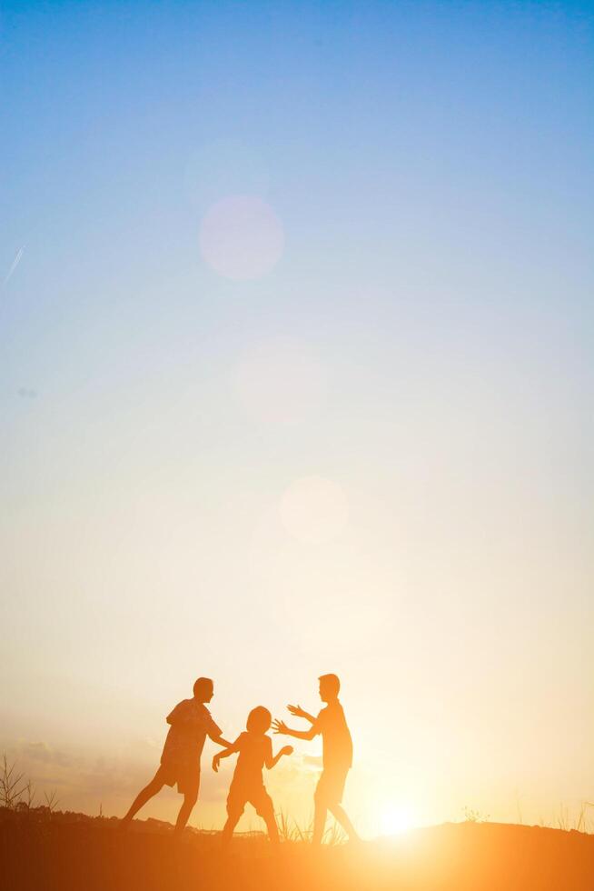 Children playing on summer sunset happy time photo