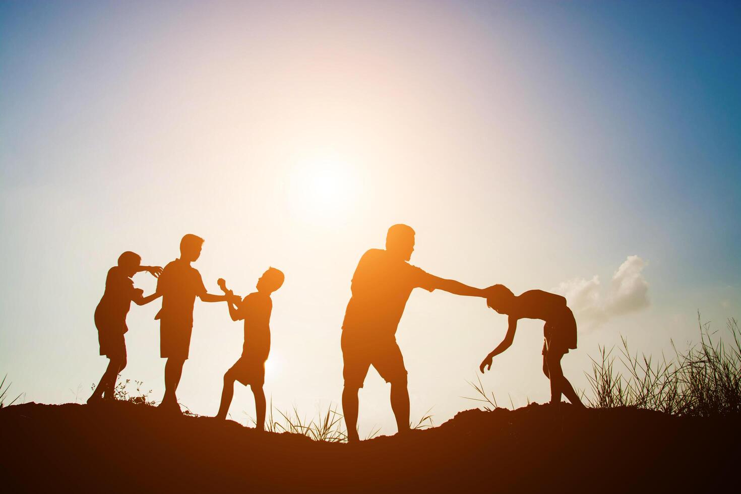 Children playing on summer sunset happy time photo