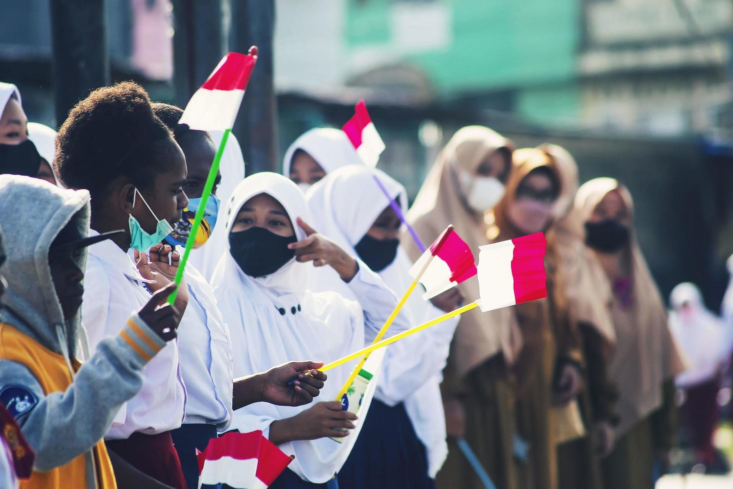 Sorong, West Papua, Indonesia, October 4th 2021. State Visit of the President of Indonesia, Joko Widodo. School children and teachers welcomed the president's arrival from the side of the road. photo