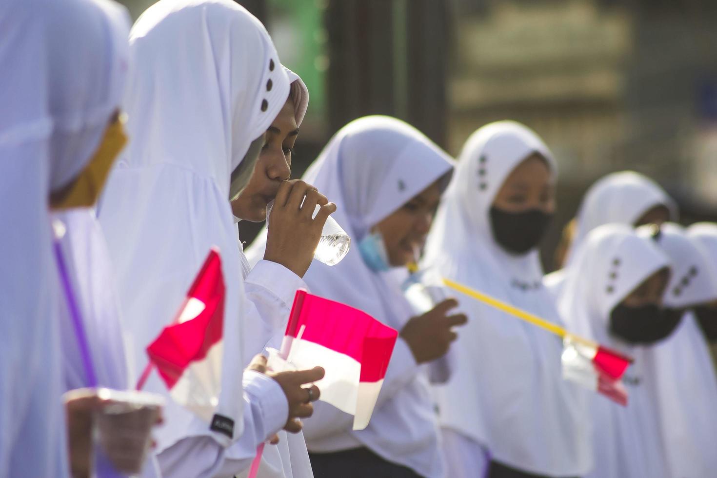 Sorong, West Papua, Indonesia, October 4th 2021. State Visit of the President of Indonesia, Joko Widodo. School children and teachers welcomed the president's arrival from the side of the road. photo