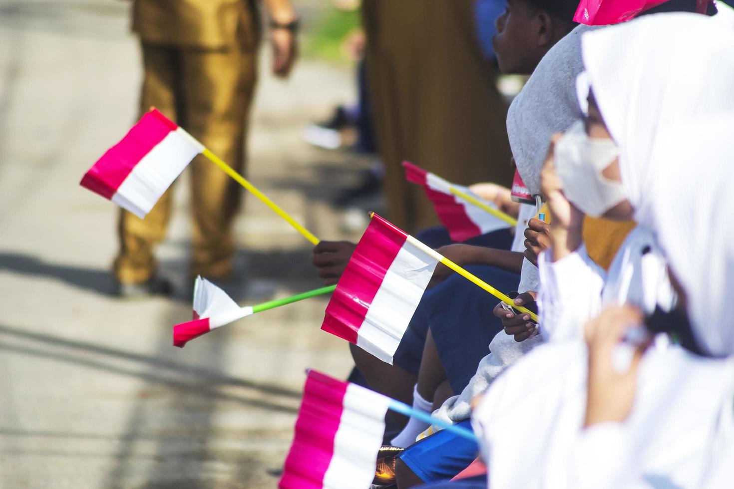Sorong, West Papua, Indonesia, October 4th 2021. State Visit of the President of Indonesia, Joko Widodo. School children and teachers welcomed the president's arrival from the side of the road. photo