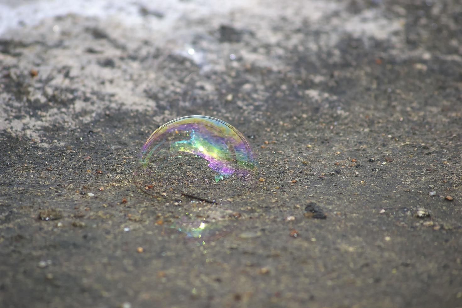 Water bubble falling on the ground photo