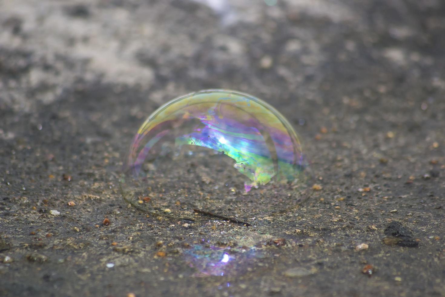 Water bubble falling on the ground photo