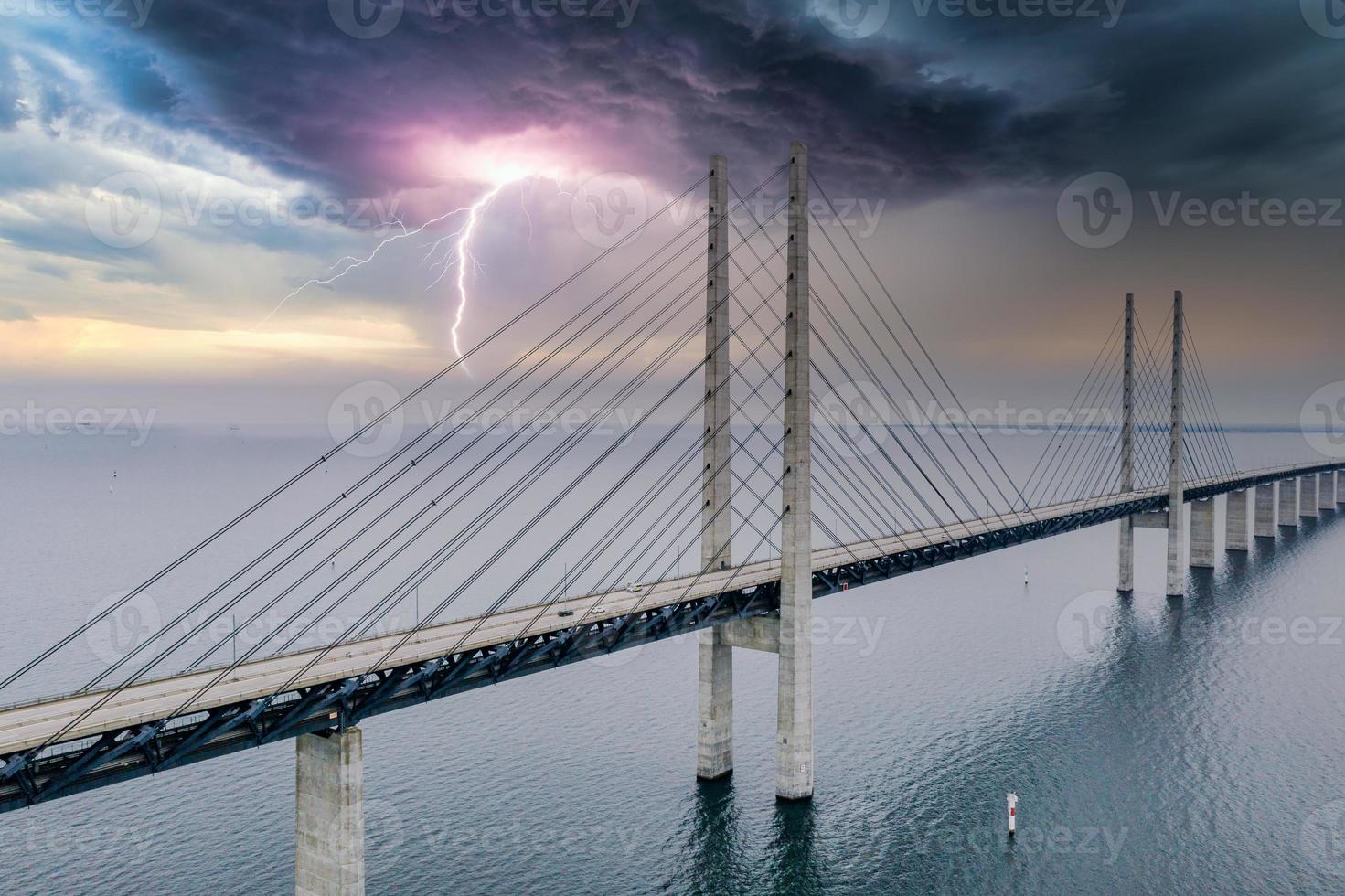 Panoramic view of Oresund bridge during thunderstorm and lightning over the Baltic sea photo