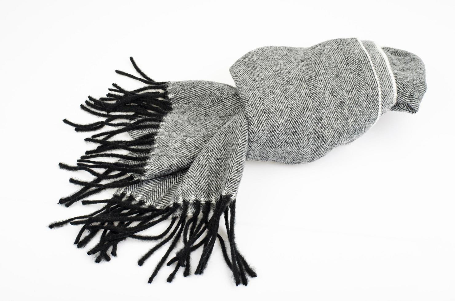 Warm stylish gray wool scarf on white background. Studio Photo