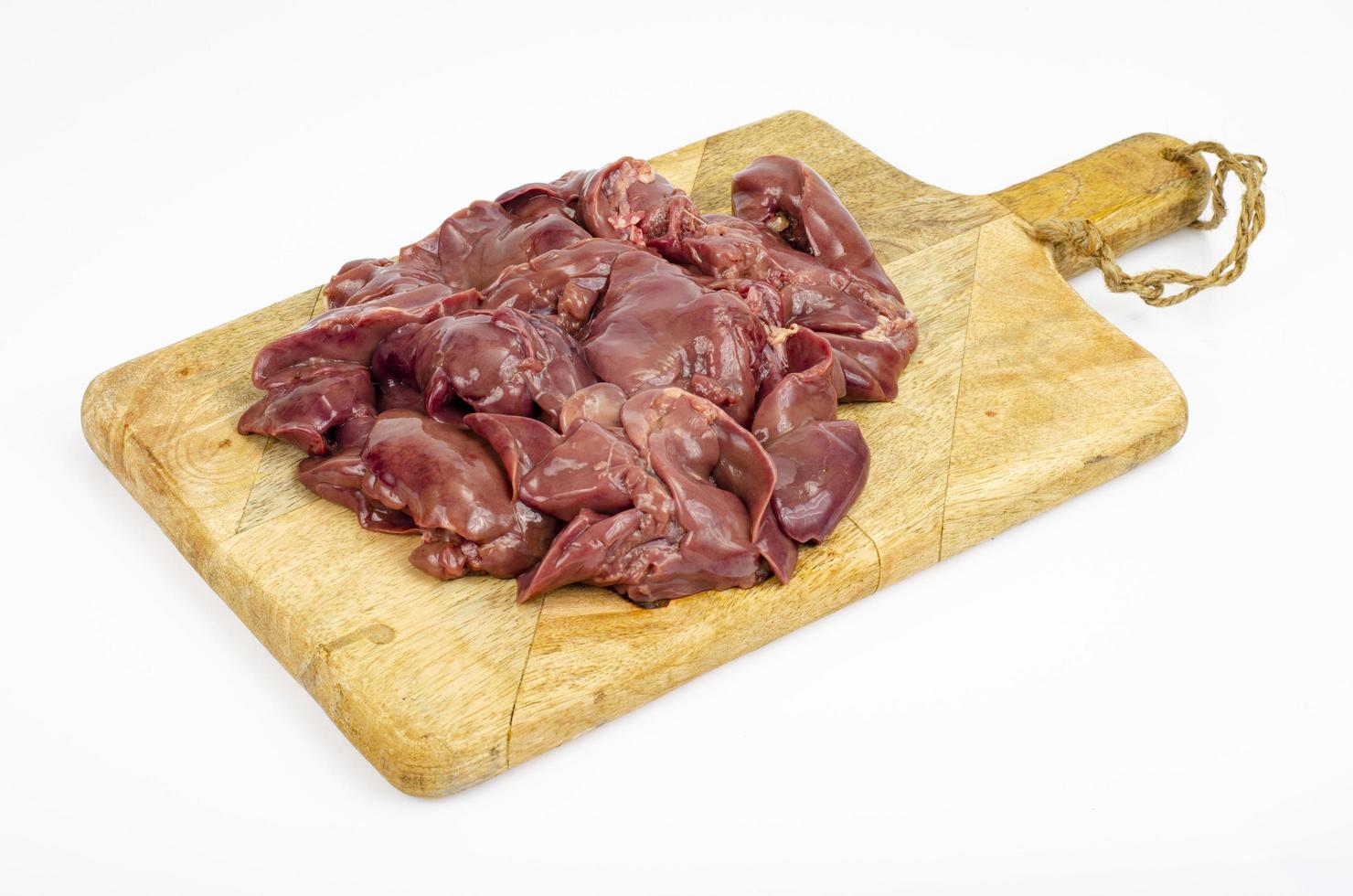 Raw chicken livers close-up on cutting board, ingredients for cooking, on white background. Studio Photo
