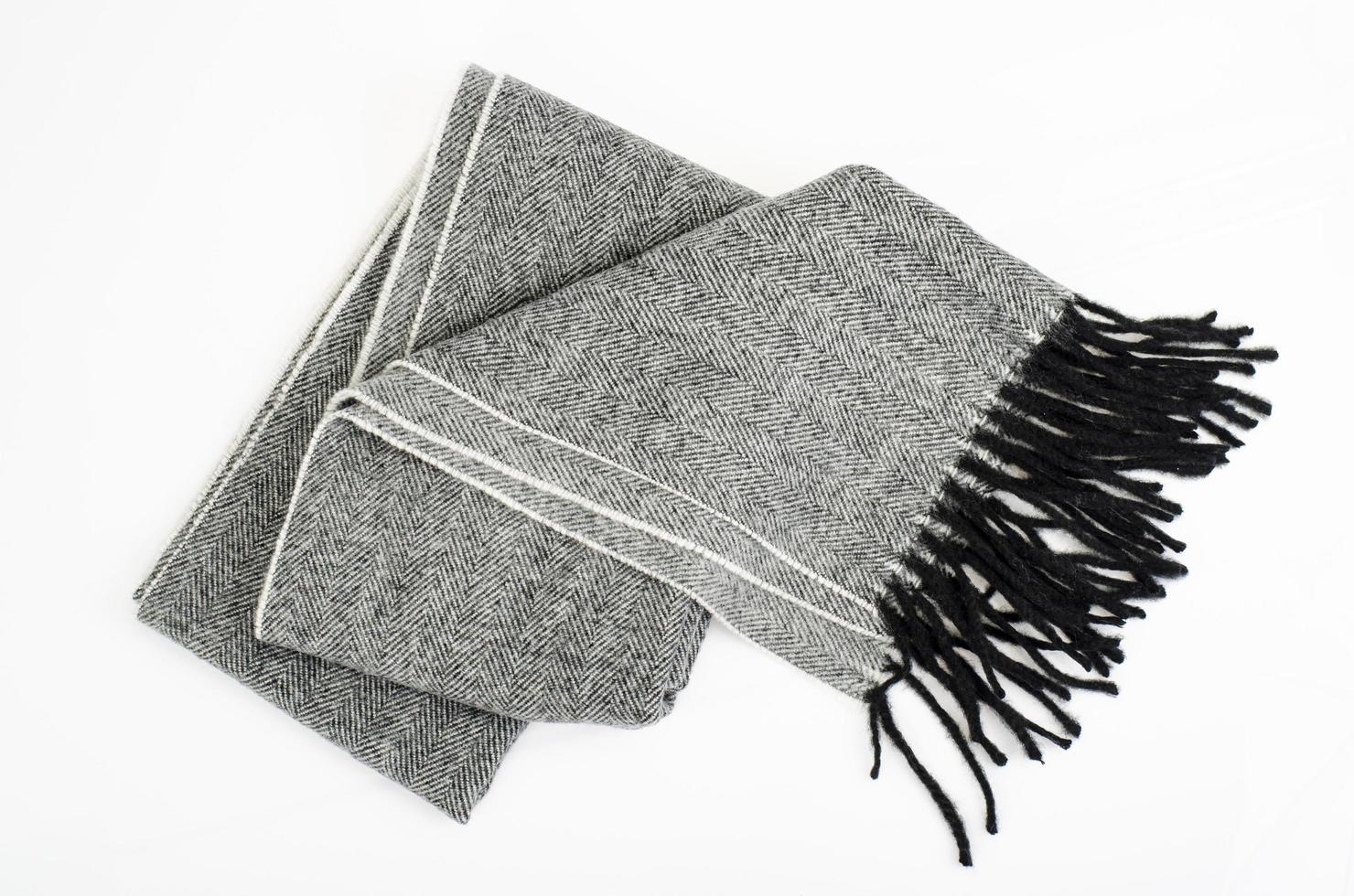 Warm stylish gray wool scarf on white background. Studio Photo