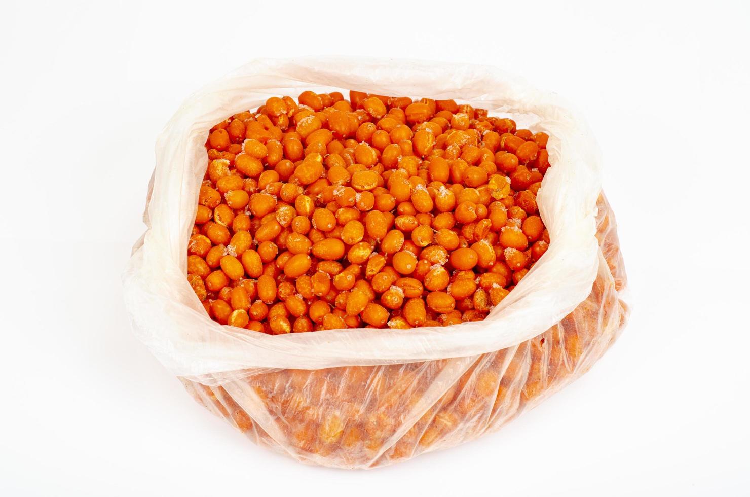 Ripe frozen orange sea buckthorn berries. Studio Photo