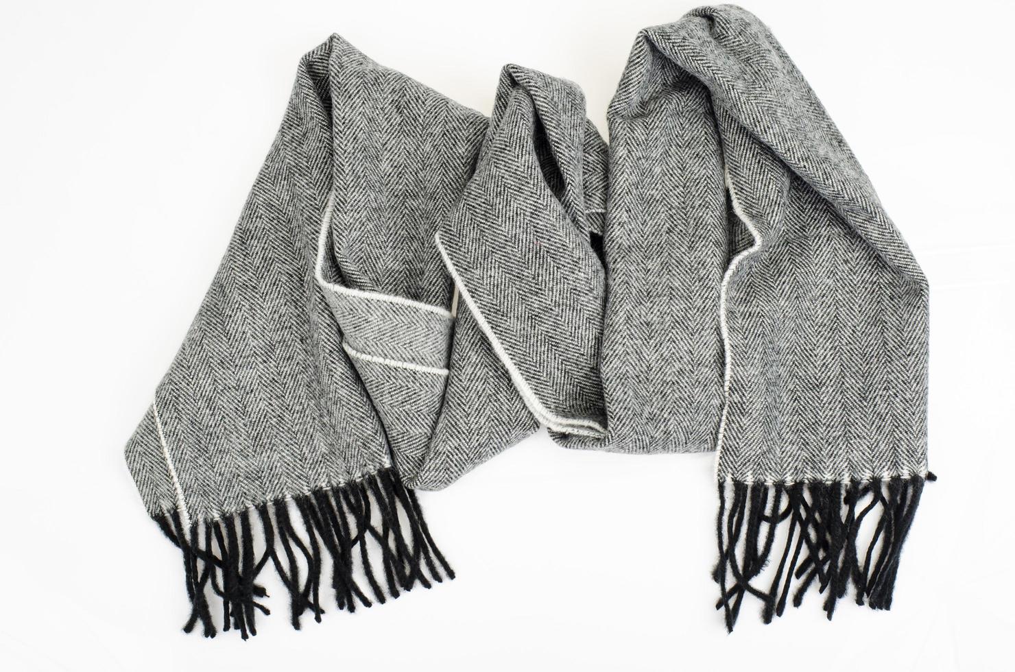 Warm stylish gray wool scarf on white background. Studio Photo