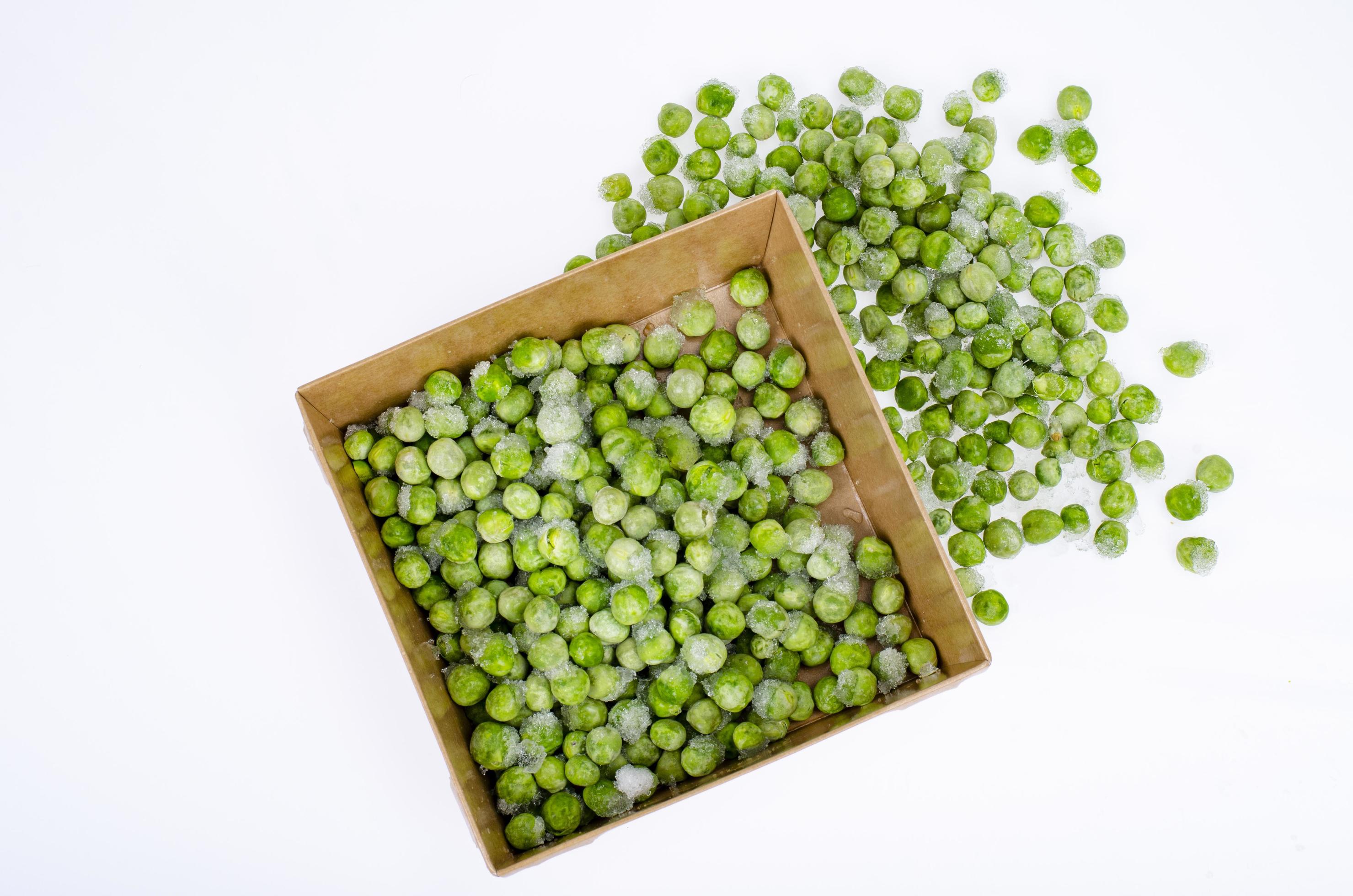Frozen green peas, preservation of vitamins and vegetables. Studio