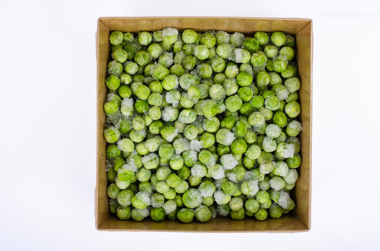 Frozen green peas, preservation of vitamins and vegetables. Studio Photo