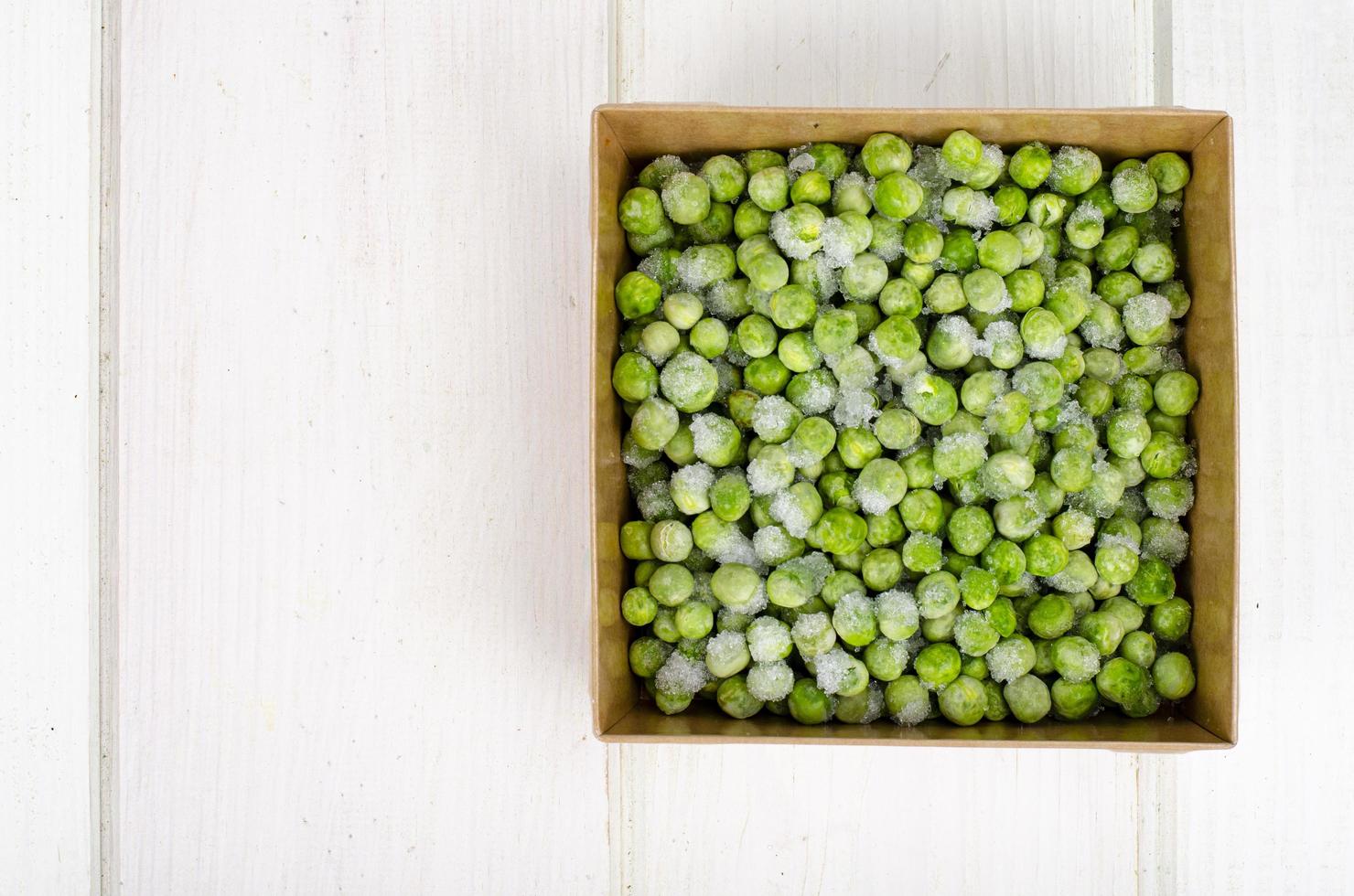 Frozen green peas, preservation of vitamins and vegetables. Studio Photo