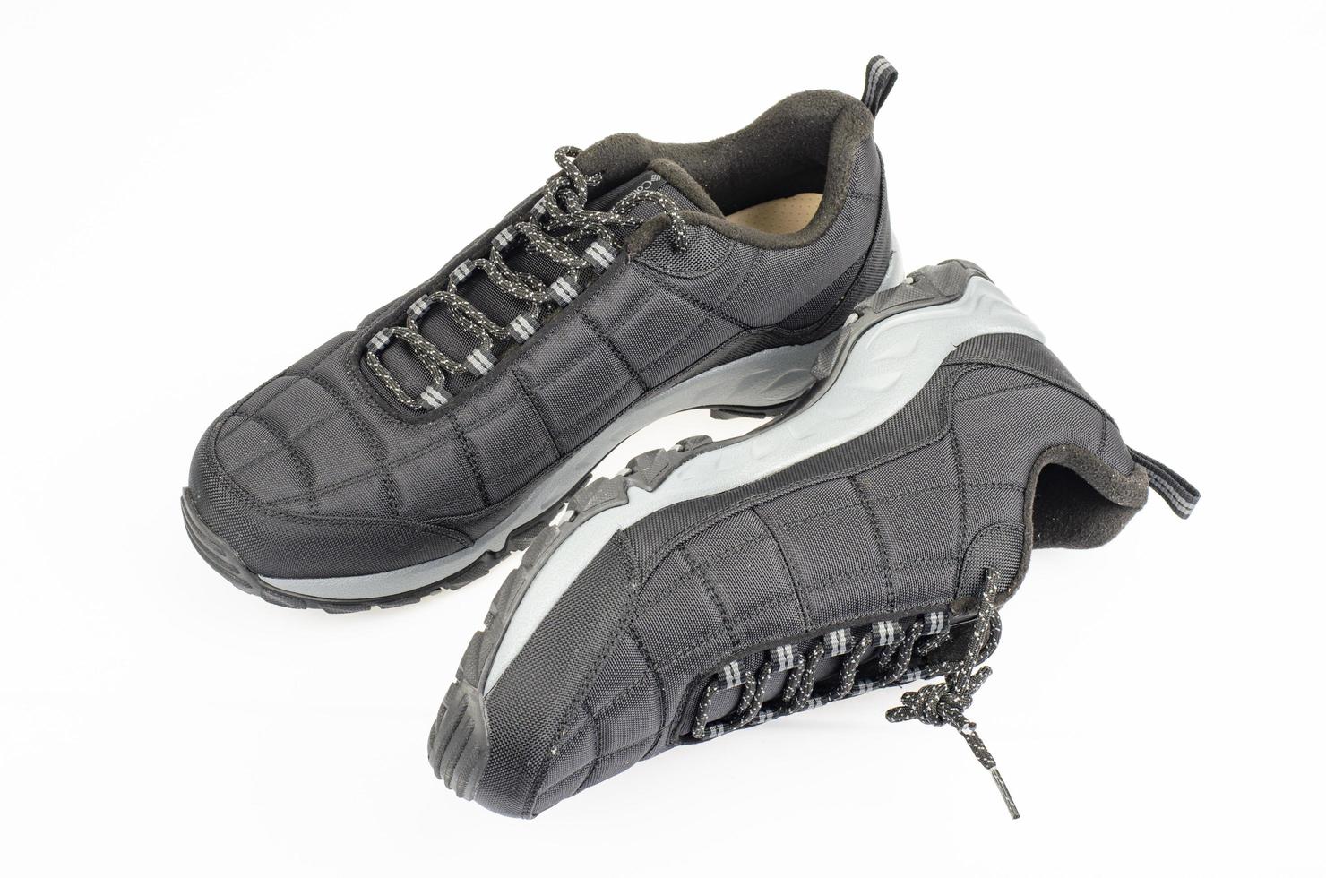 Black sports insulated shoes on white background. Studio Photo