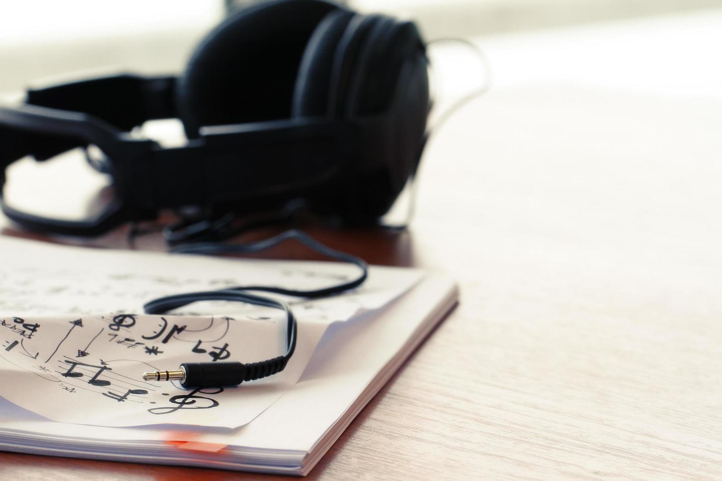 composing music concept with shallow DOF evenly matched jack of headphone and copy space photo