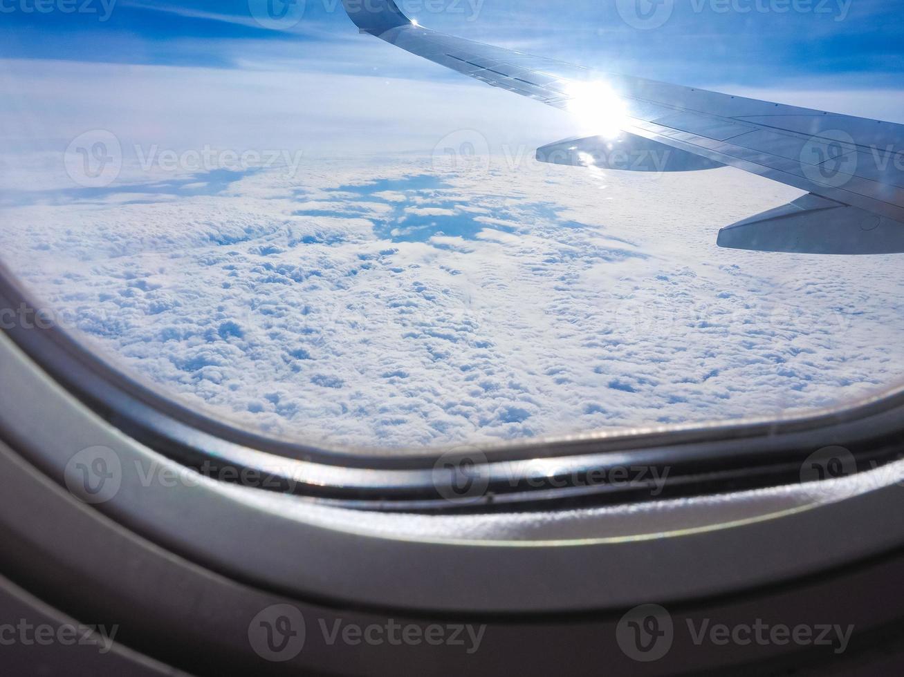 blue sky with clouds seen from plane photo