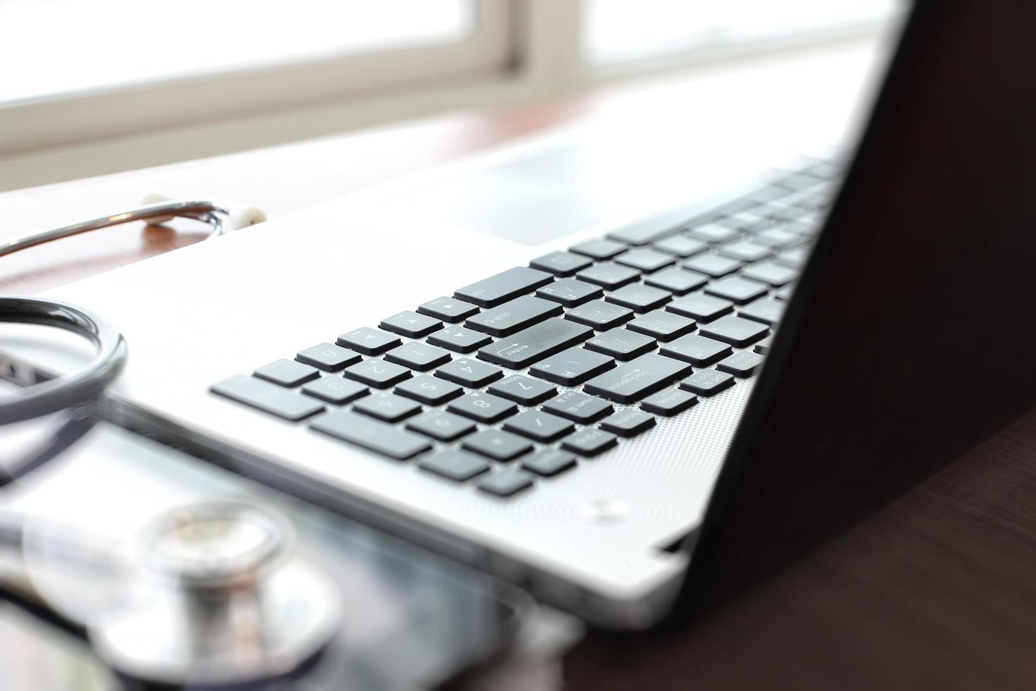 Doctor working with laptop computer in medical workspace office as concept photo