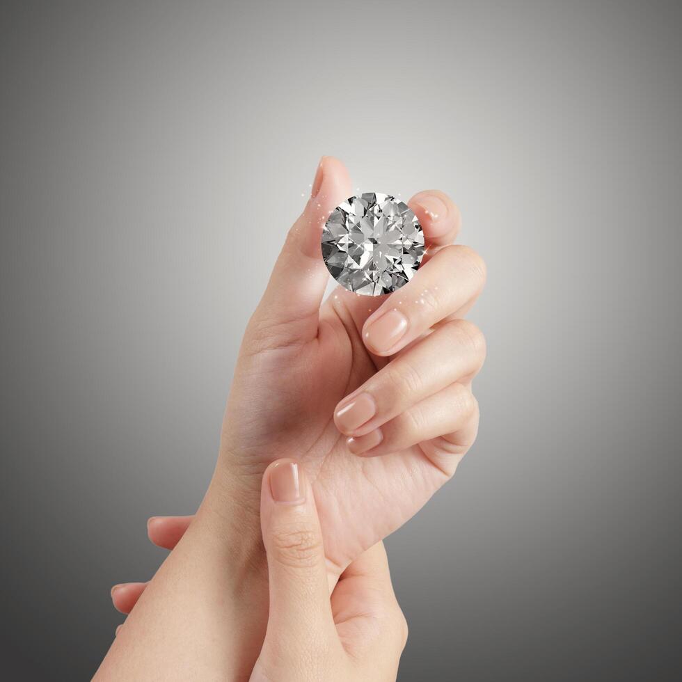 hand holding 3d diamond over grey background photo