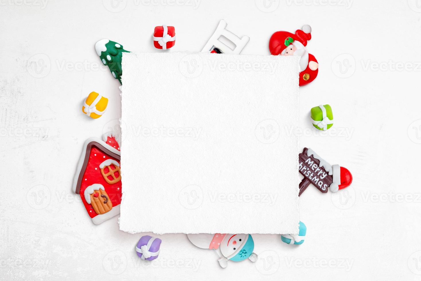 Blank Christmas square greeting card surrounded by Christmas decorations photo