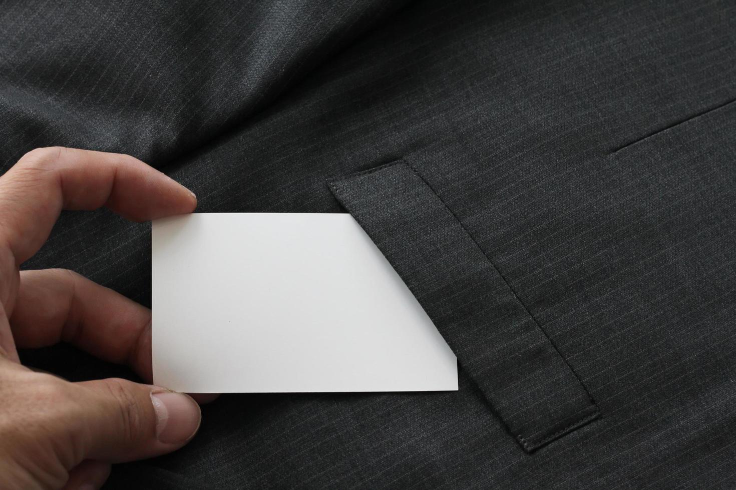 Blank corporate identity package business card with dark grey suit background. photo