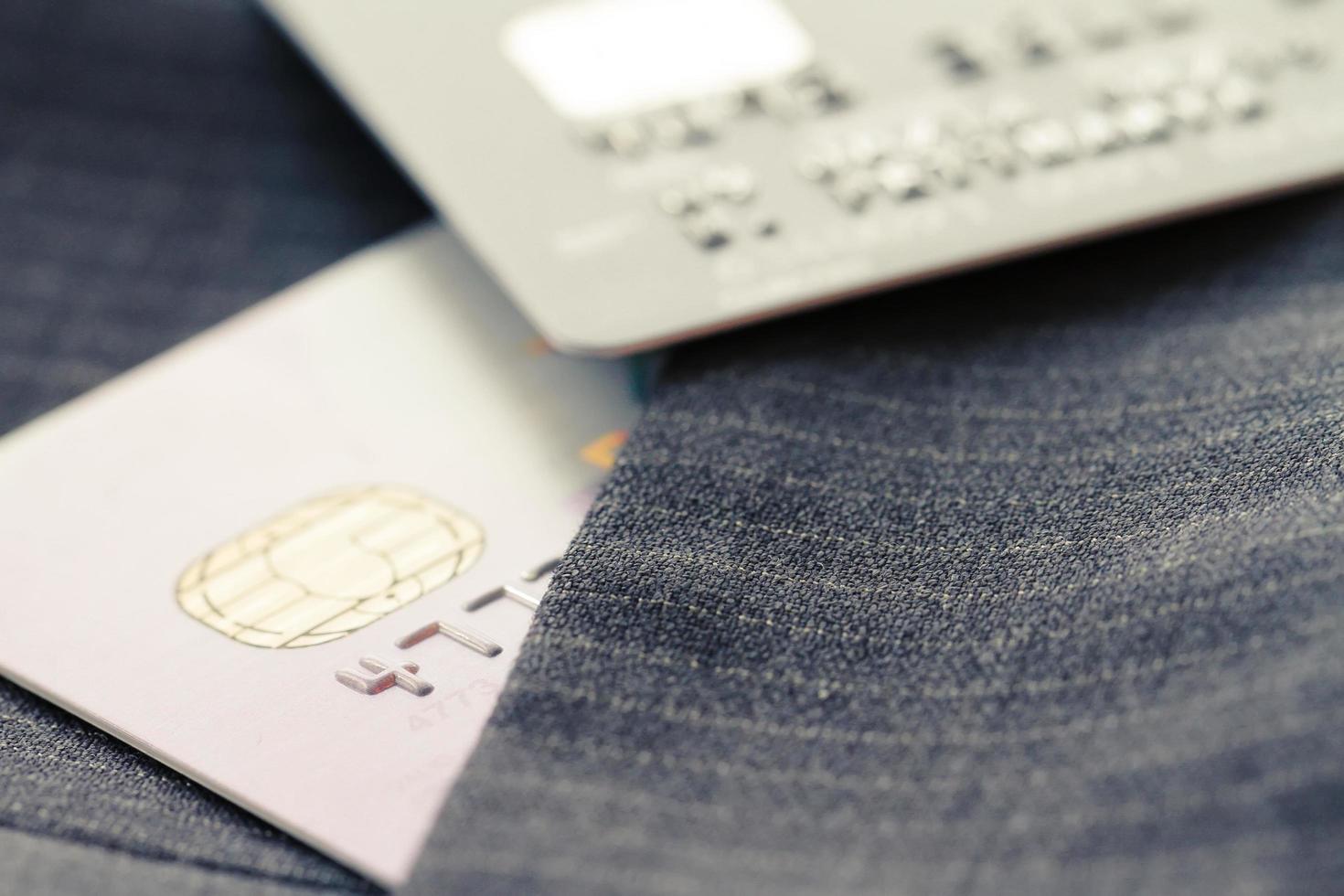 Credit cards in very shallow focus with gray suit background photo