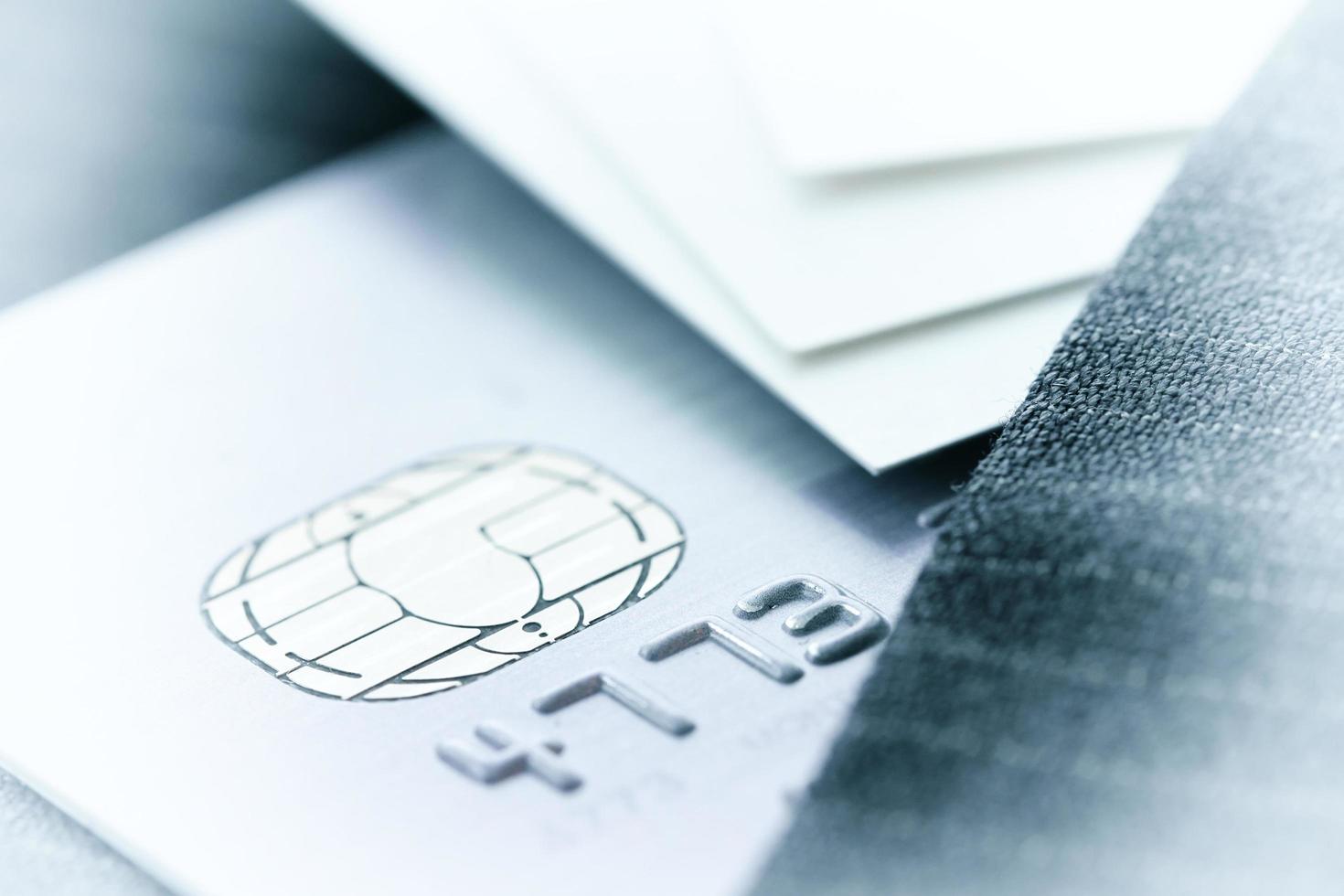 Credit cards in very shallow focus with gray suit background as online shopping concept photo