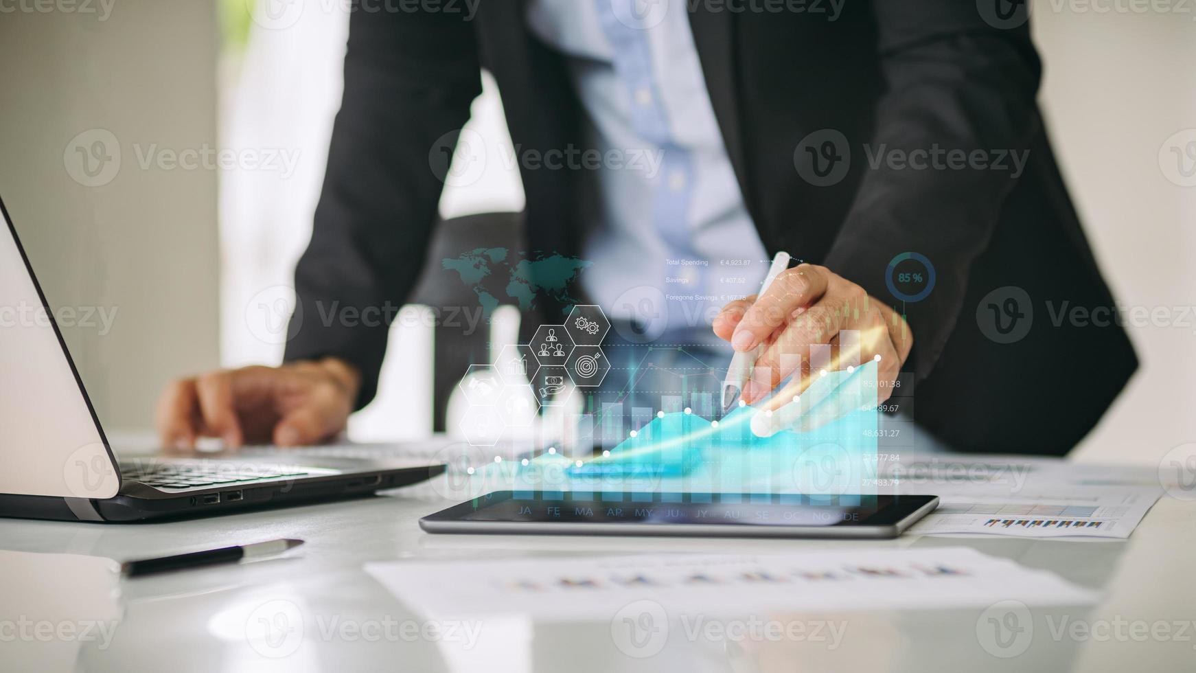 Businessman work with ai for economy analysis financial result by digital augmented reality graph. Concept for entrepreneur leader of invest in business and digital marketing technology of the future photo