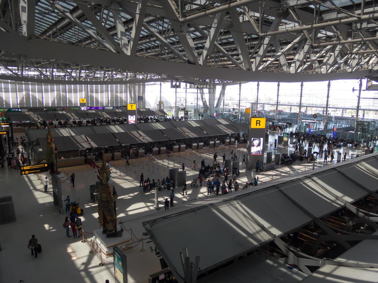 Suvarnabhumi BANGKOK THAILAND31 OCTOBER 2018In the airport passengers are walking to different areas of the airport. Suvarnabhumi Airport is Thailands main airport.0n BANGKOK THAILAND. photo