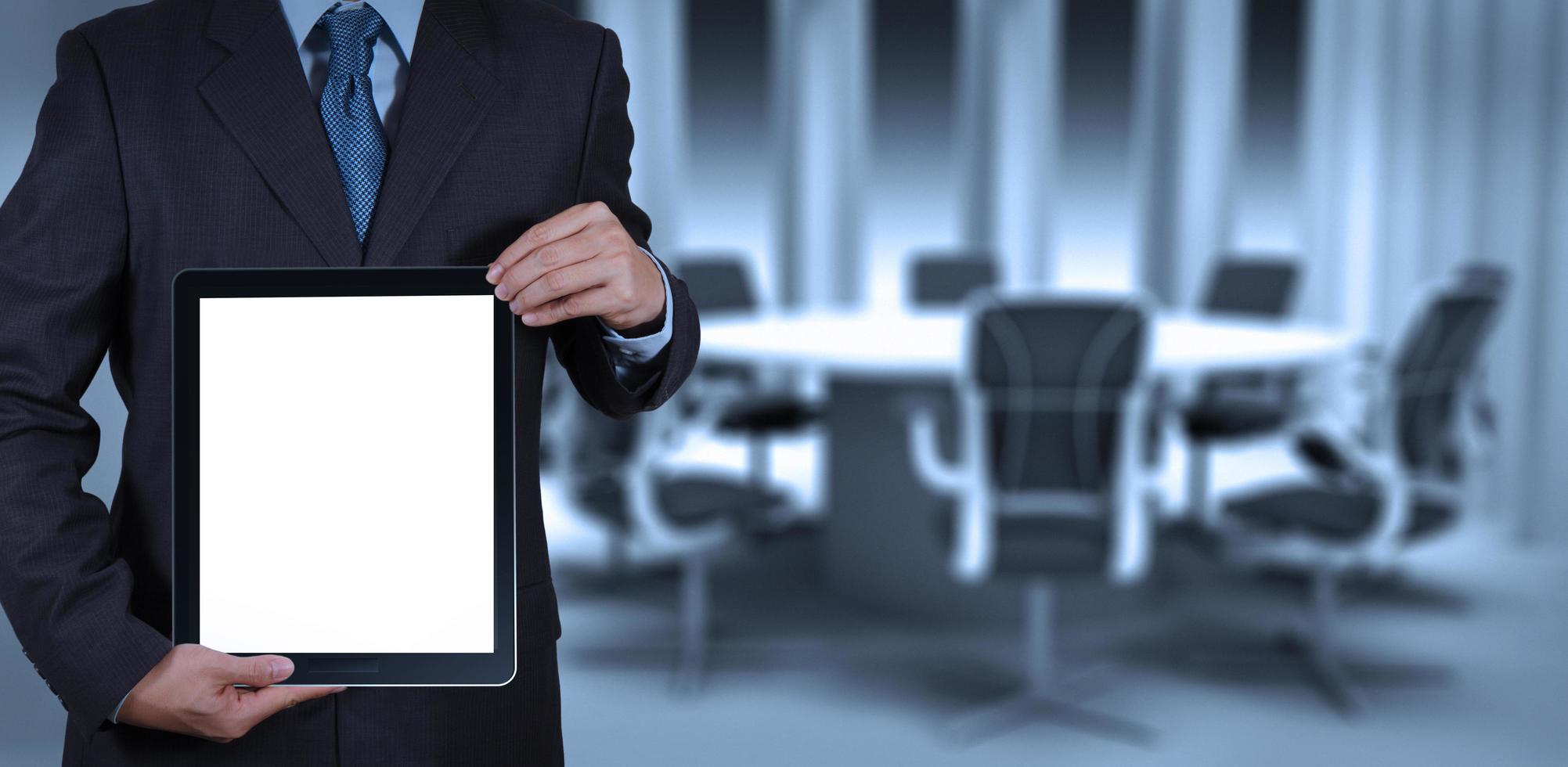 businessman success working with blank tablet computer his board room photo